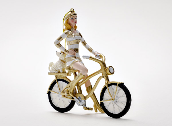 Christmas tree toy Girl on a bicycle with a dog