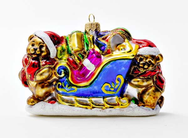 Christmas tree toy Teddy bears on a sleigh with gifts