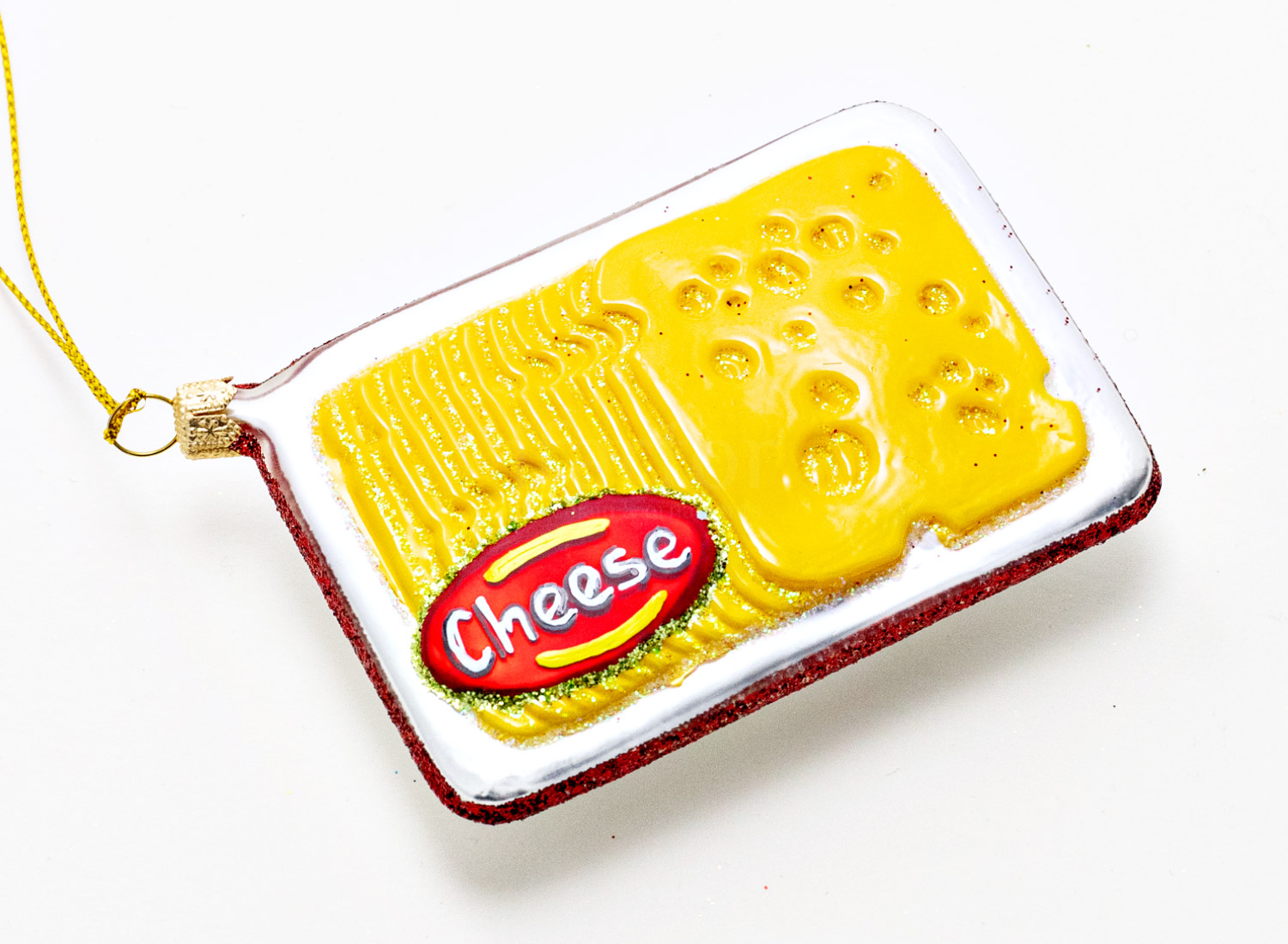 Елочная игрушка «Упаковка с сыром» Стекло. 65 x 100 мм.