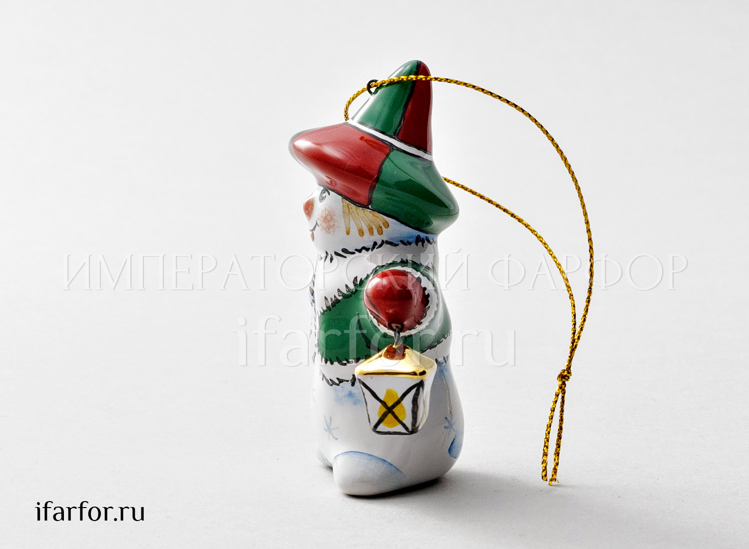 Елочная игрушка «Снеговик с фонариком» Форма: Снеговик с фонариком. Майолика. 35 x 53 x 82 мм.