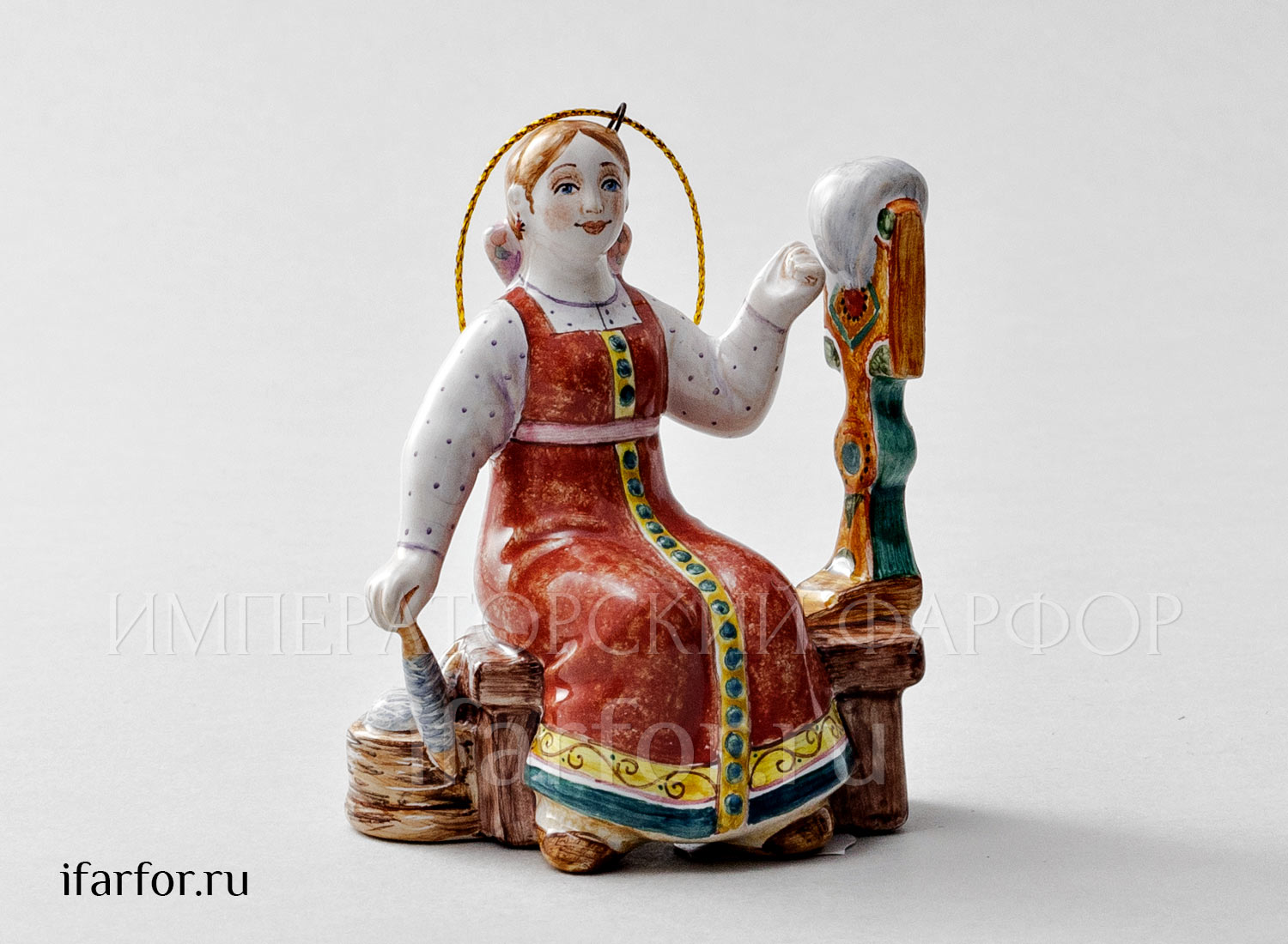 Елочная игрушка «Пряха» Форма: Пряха. Майолика. 65 x 90 мм.