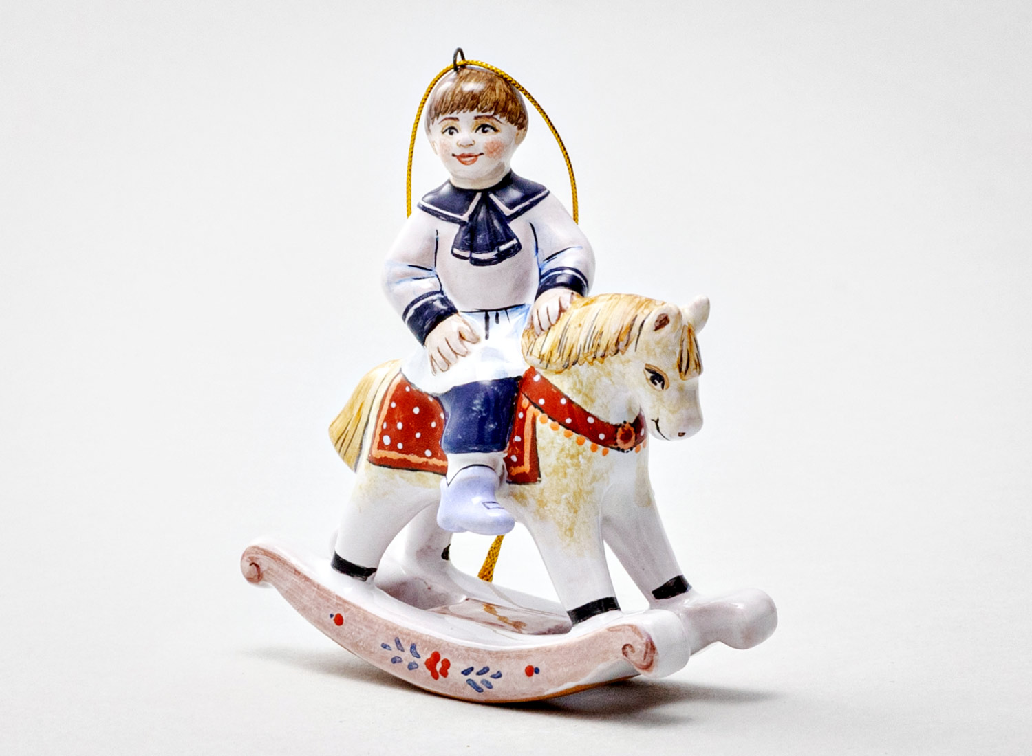 Елочная игрушка «Мальчик на лошадке» Форма: Мальчик на лошадке. Майолика. 85 x 95 мм.
